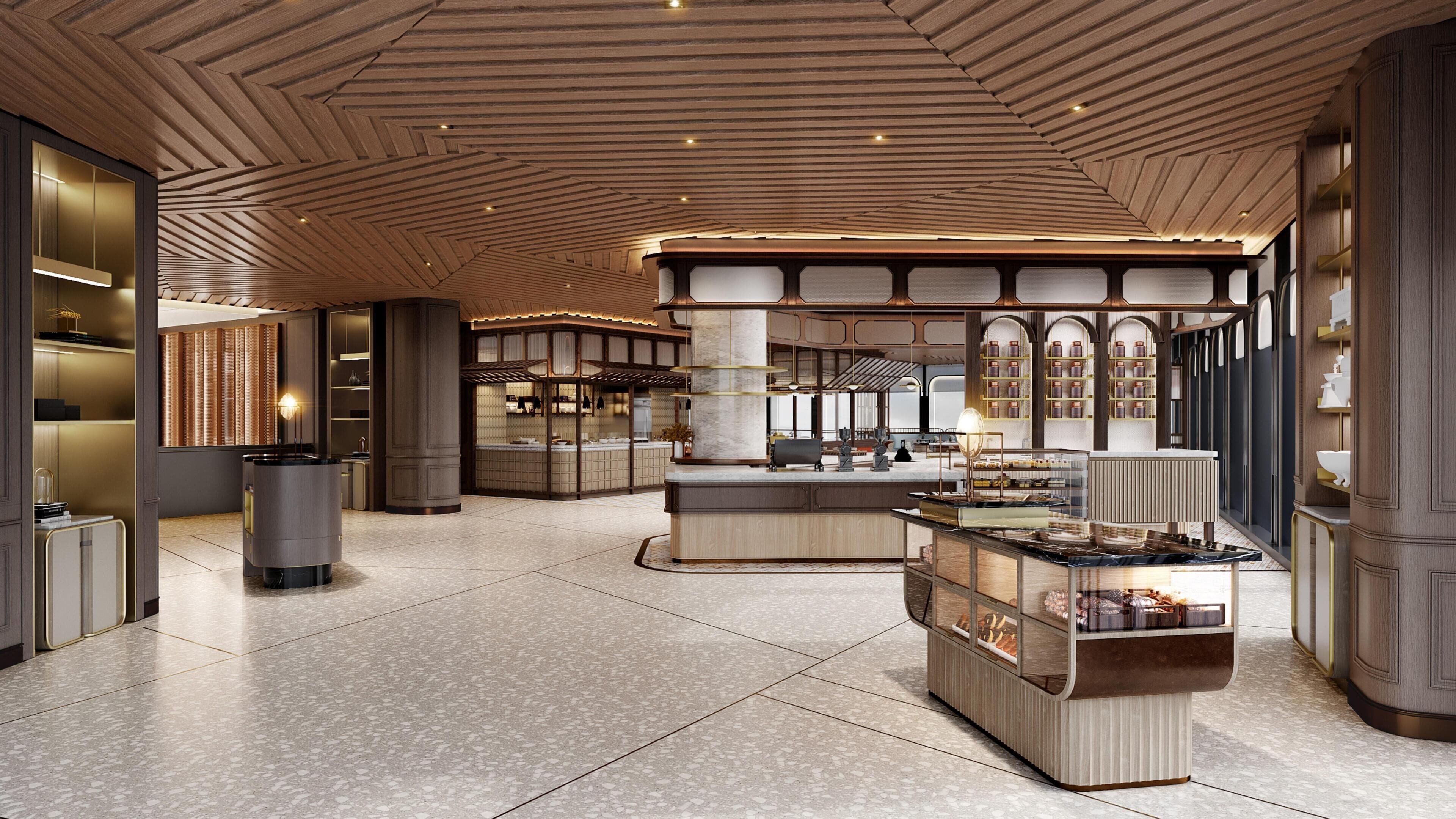 Un lobby espacioso con techo alto, mostrador de recepción central e interior moderno y bien iluminado.
