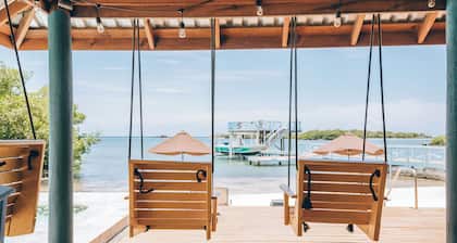 Spacious 5-bedroom beachfront home with AC centrally located in Roatan.