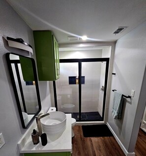 Shower, hair dryer, towels, soap