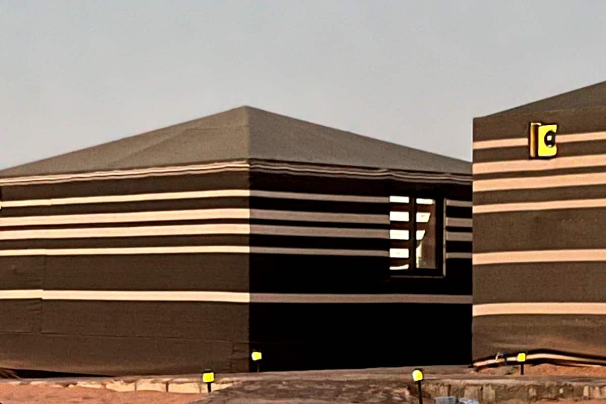 A building with a striped facade and a visible window.