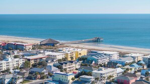 A coastal town with beachfront hotels, a pier, and a beach. - Screened Porches | Ping-Pong Table Pet-Friendly | Walk to Beach & Pier (Tybee Island)