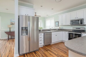 Fridge, microwave, stovetop, dishwasher - Marsh Haven | 3BR Coastal Getaway with Screened Porch & Peaceful Views (Tybee Island)