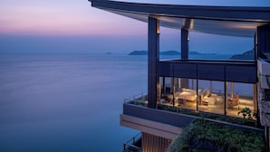 A modern hotel with a balcony overlooking a calm sea and distant islands. - Alila Dong Ao Island Zhuhai (Zhuhai)