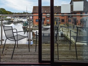 Property grounds - Attractive "upside down" waterside home, with four en-suite bedrooms. (Horning)