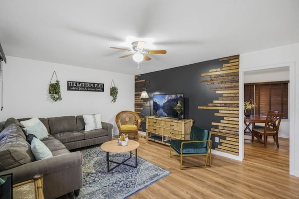 The open layout connects the living room to the adjacent dining area.