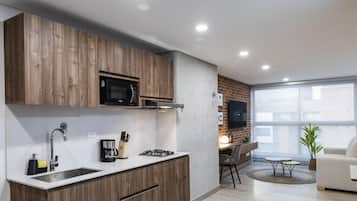 Appartement Deluxe | Cuisine privée | Grand réfrigérateur, micro-ondes, cafetiÚre/bouilloire, blender