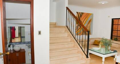Charming 1-bedroom house with AC, TV, bathroom, WiFi, pool, parking, camara