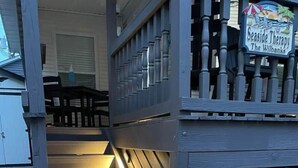 A wooden staircase leading to a door with a 'Hello' mat. - Seaside Therapy  (Myrtle Beach)
