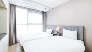 Camera con 2 letti singoli, non fumatori, angolo cottura | 1 camera, Wi-Fi gratuito