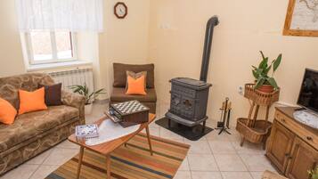 House (Three Bedroom Holiday Home) | Living room | 32-inch flat-screen TV with satellite channels