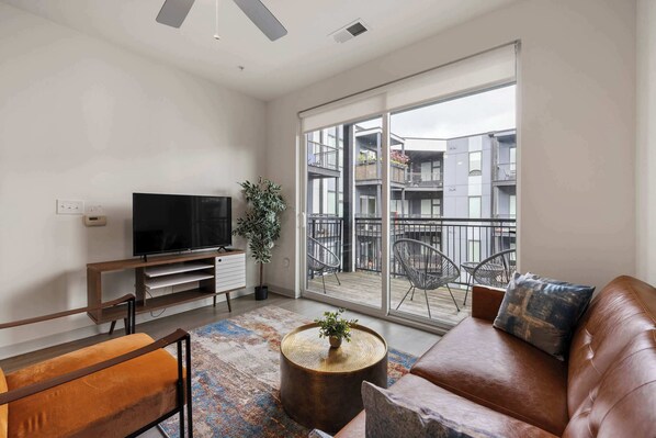 Deluxe Apartment | Living area | 42-inch Smart TV with digital channels, Netflix, Hulu - Two Charming Nulu CozySuites (Louisville)