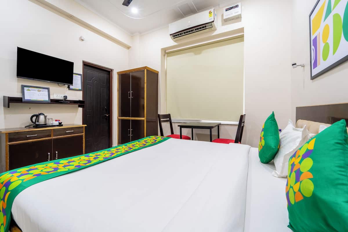 Desk, blackout curtains, iron/ironing board, bed sheets