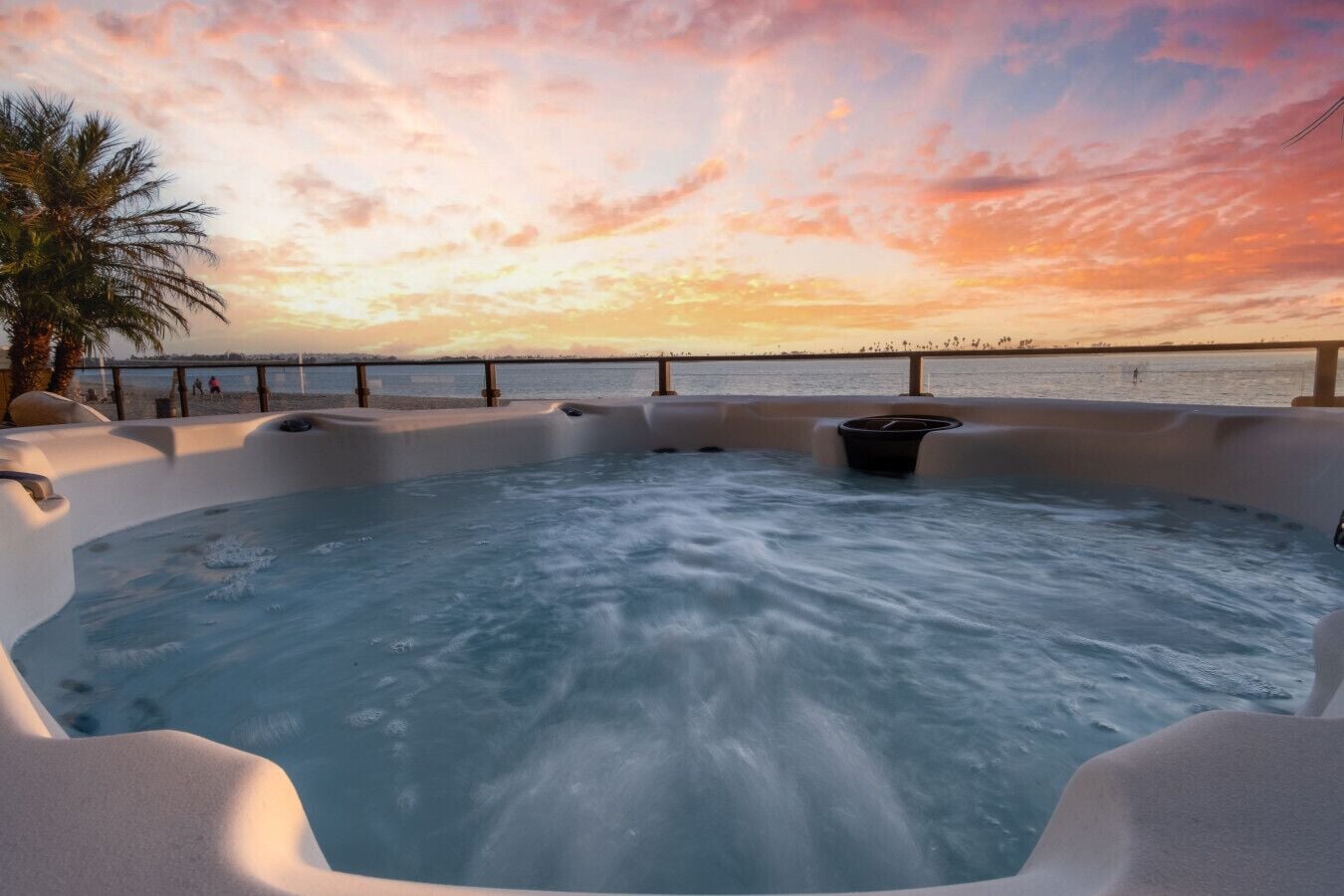 Relax in the hot tub while watching the sunset on the bay!