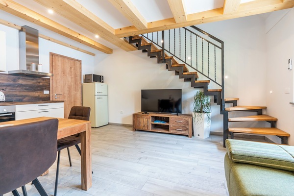 Apartment, Garden View | Living area | 108-inch Smart TV with cable channels