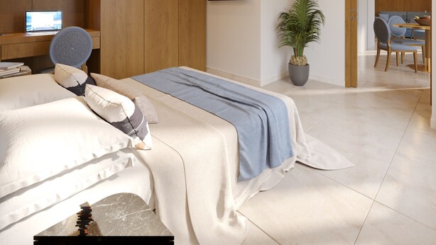 A modern bedroom with a bed, bedside table, bookshelf, and a potted plant.
