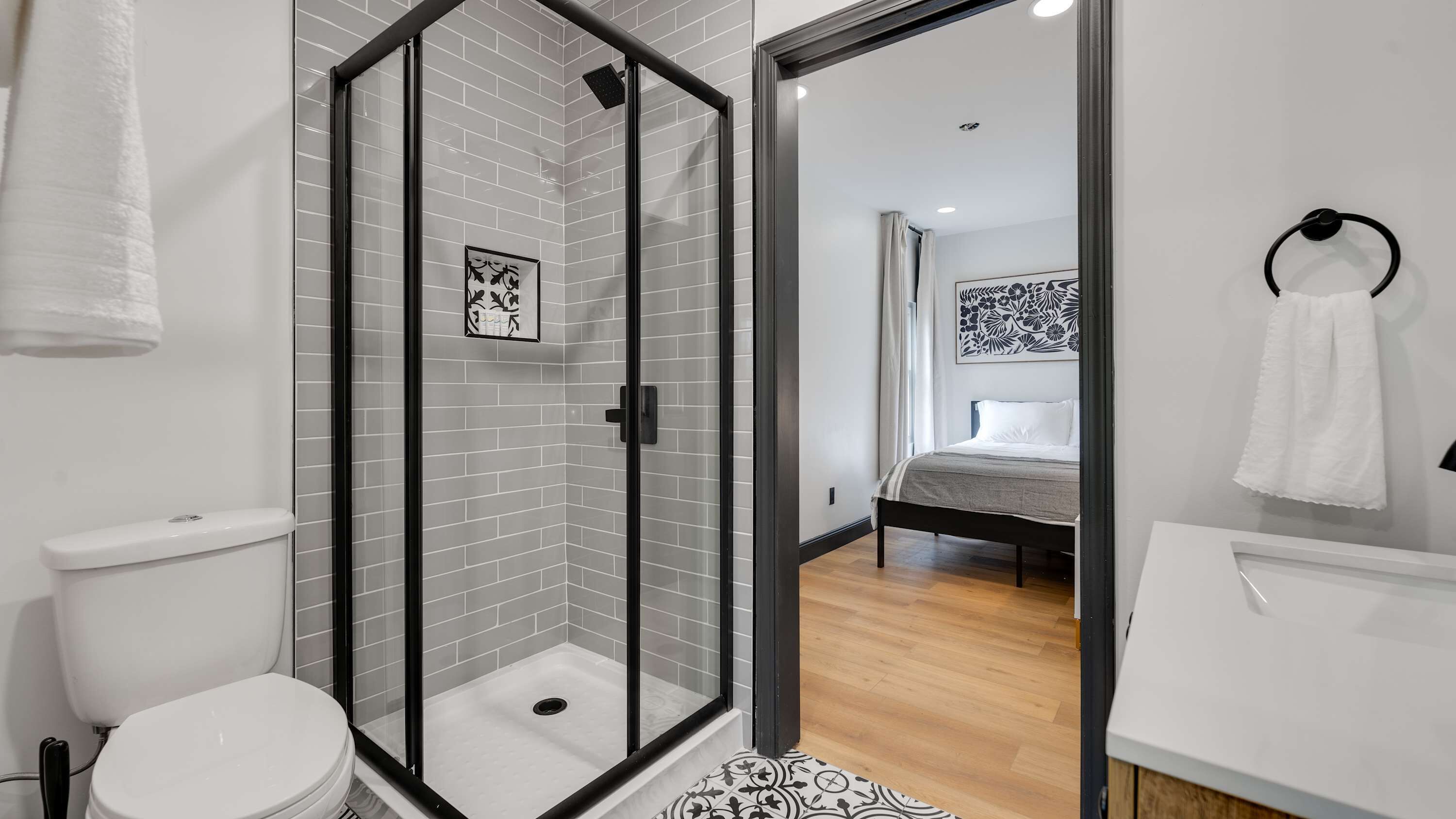 Shower, hair dryer, towels, shampoo