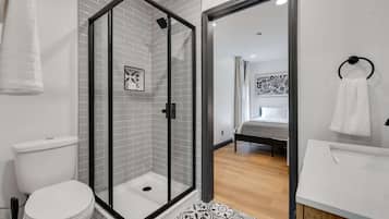 Shower, hair dryer, towels, shampoo