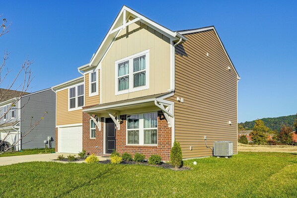 A two-story house with a front porch, a garage, and a well-maintained lawn. - 16 Mi to Louisville: Pet-friendly Getaway! (Shepherdsville)