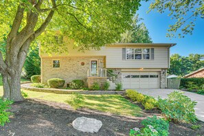 A two-story house with a brick facade, a front porch, and a garage. - 3 Mi to Lake Redman: Home w/ Furnished Pergola! (York)