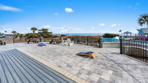 A wooden deck with outdoor seating, a view of the beach, and a gazebo. - B554 at the Myrtle Beach Resort (Myrtle Beach)