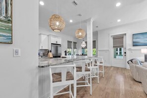 Coffee/tea maker, toaster, ice maker, dining tables