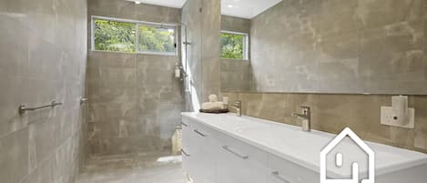 Shower, hair dryer, towels, toilet paper