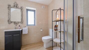 Shower, hair dryer, towels, soap