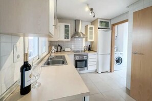 Villa | Private kitchen | Fridge, microwave, oven, stovetop