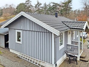 A small, single-story building with a grey exterior and a tiled roof. - 4 Star Holiday Home in Svanesund (Svanesund)