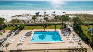 A pool area with lounge chairs and a view of the beach. - 30-Foot Oceanfront Balcony |Oceanfront Pool|Heart of Destin (Destin)
