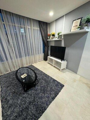 Family Apartment, 3 Bedrooms, Non Smoking, City View | Living area | Flat-screen TV