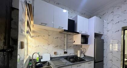 Cozy 2-bedroom apartment in Ikeja with AC, WiFi, & fully equipped kitchen.