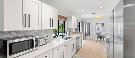 Fridge, paper towels, dining tables