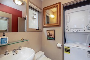 A bathroom with a sink, toilet, mirror, and a wall-mounted washing machine. - Shirana #7 2 Bedroom Plus Loft (Mountain Village)