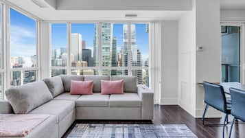 Executive Condo, Kitchen, City View | Living area | 50-inch LED TV with digital channels, Netflix, streaming services