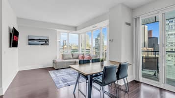 Executive Condo, Kitchen, City View | Living area | 50-inch LED TV with digital channels, Netflix, streaming services