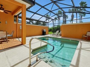 An indoor swimming pool with a glass ceiling, surrounded by lounge chairs and a sunbed. - Adorable townhome remodeled with comfort and relaxation in mind! Splash Pool! (Kissimmee)