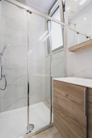 Shower, hair dryer, towels, soap