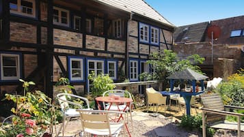 Apartamento | Restaurante al aire libre