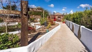 A pathway leading to a rustic building with a sign that reads 'The Shebang.' - The Hideaway Muff - Private estate, Shebeen, Lough Foyle (Muff)
