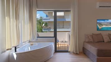 Premium Suite | 1 bedroom, premium bedding, Select Comfort beds, minibar