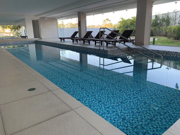 Indoor pool, open 6:00 AM to 10:00 PM, pool loungers
