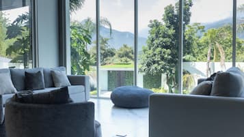 Luxury Villa, Garden View | Living area | TV