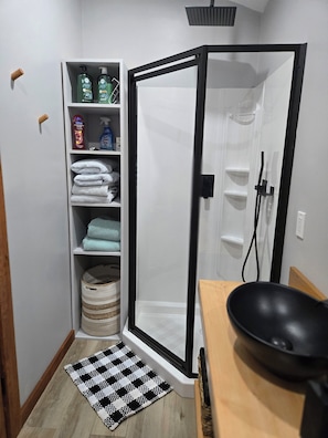 Shower, hair dryer, towels, soap