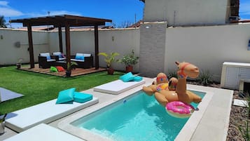 Outdoor pool, a heated pool, pool loungers