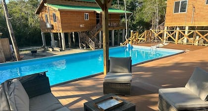 Sade's Enchanted cabin Luxurious Jungle Cabin near the River with AC and WIFI