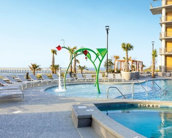 Soak up the sun in the poolside area with comfortable lounge chairs and ocean views.