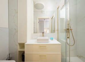 Shower, hair dryer, towels, soap