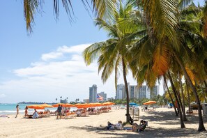 On the beach, sun loungers