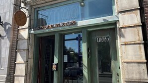 A building with a sign reading "MARKS OF DISTINCTION" and a door labeled "105A". - Perfect Work Retreat on Market St. Downtown ILM (Wilmington)